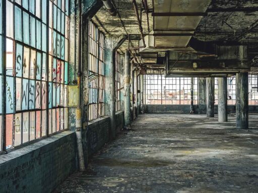How environmental Justice impoverishes the poor - shows an abandoned automotive plant in Detroit Michigan.